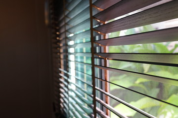 brown blind shade and mosquito wire screen on window, interior design decoration in home office