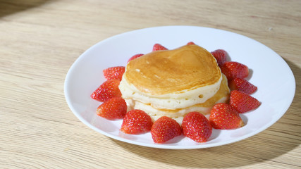pancake and strawberry fruit sweet dessert food put on breakfast table