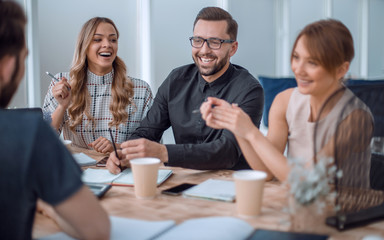 business team discussing business issues over a Cup of coffee