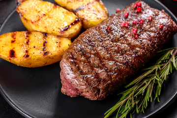 Ribeye steak with potatoes, onions and cherry tomatoes