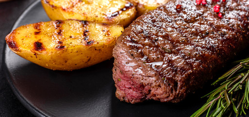 Ribeye steak with potatoes, onions and cherry tomatoes