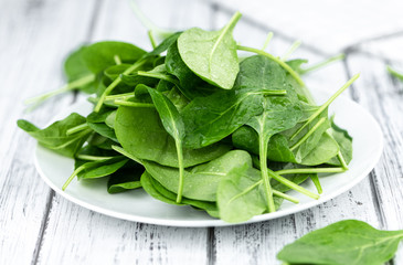 Portion of fresh Spinach (close-up shot)