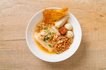 spicy noodles with fish ball and minced pork (Tom Yum Noodles)