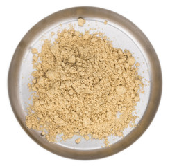 Some Powdered Ginger isolated on white (selective focus)