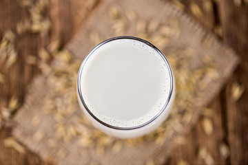 Portion of fresh Oat Milk (selective focus; close-up shot)