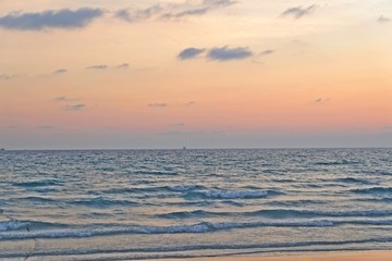 Sunset beautiful golden yellow. Beach, sea, sandy beach. On twilight.