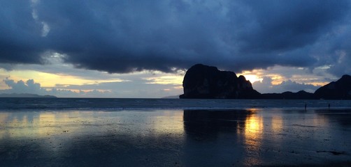 Beautiful landscape of sunset and silhouette mountain in PhangNga bay Thailand.Unseen place of "Samed Nangshe" or "Samet Nangchee" in Phang Nga province, Thailand.