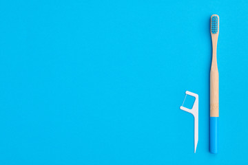 Toothbrush on blue background top view