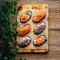  bruschettas with fish on the table