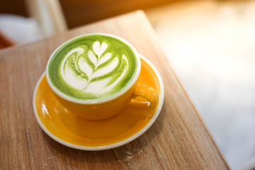 Cup of Matcha green tea latte in cafe