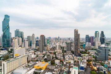 Cityscape of picturesque Bangkok at daytime from rooftop. Panoramic skyline of the biggest city in Thailand. The concept of metropolis. Unique Asia.