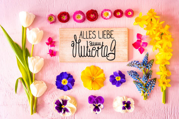 Rustic Wooden Sign With German Calligraphy Alles Liebe Zum Muttertag Means Happy Mothers Day. Flat Lay With Spring Flower. Wooden Pink Background