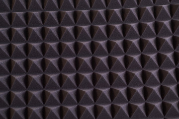 The pattern of the soundproof panel of polyurethane foam. black geometric background