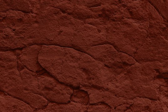 terracotta shabby stucco background with cracks