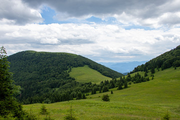 Mountain landscape with meadows, forest, hills and blue sky, Northern Slovakia