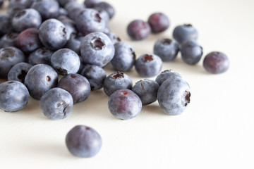 Close up of blueberries on a white background