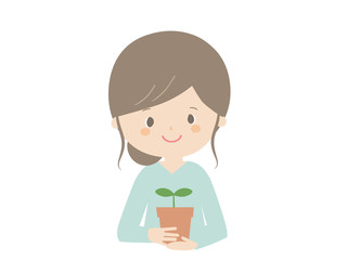 Woman holding a seedling