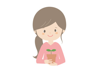 Woman holding a seedling