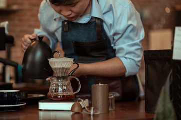 The Barista dripping roasted coffee