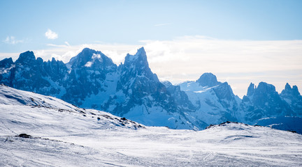 Sunny winter landscape at Ski Area in Dolomites, Italy - Alpe Lusia. Ski resort in val di Fassa near Moena