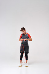 Jump more. Full-length shot of a teenage boy engaged in fitness, getting ready to skip using jump rope. Isolated on white background. Sport, training, fitness, active lifestyle concept