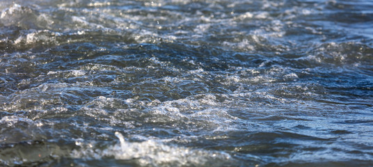 Waves on the seashore as an abstract background