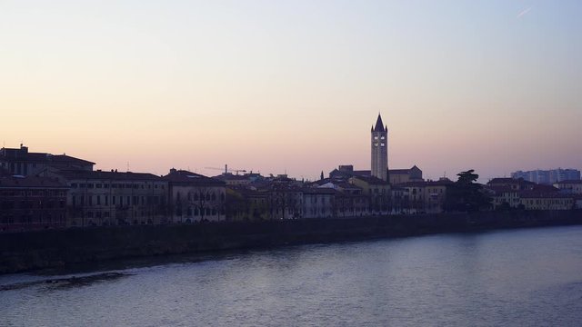 Verona sunset over the River Adige with the tower of San Zeno in the background. Italy