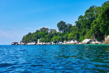 Tropical paradise island and blue sky turquoise water and granite rocks travel tourism background concept. Amazing tropical holidays in paradise beaches of Tioman island, Malaysia.
