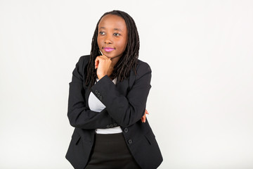 beautiful young african woman in a black suit on a white background