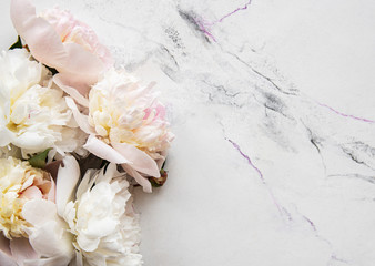 Pink peonies on a marble background