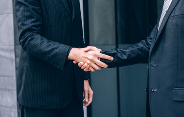 Group of Business People Shaking Hands with Partnership while Standing with Colleagues after Finish a Meeting Negotiation, Teamwork Concept