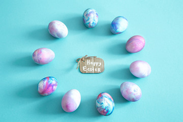 Circle of Easter eggs on a colored isolated background.