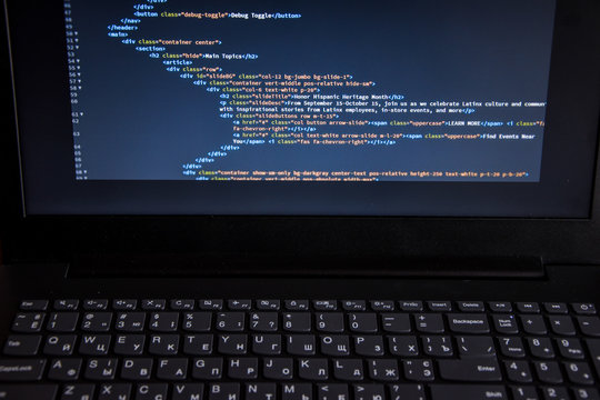 Close up css HTML code on monitor screen with black background