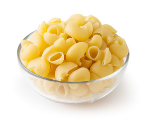 Uncooked pipe rigate pasta in glass bowl isolated on white background with clipping path