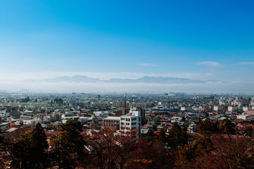 Fototapeta na wymiar Aizu Wakamatsu City view with moutain in background