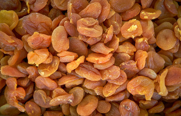 Dried apricot fruit forming a background