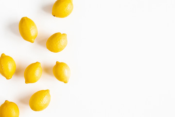 Lemons on white background. Flat lay, top view