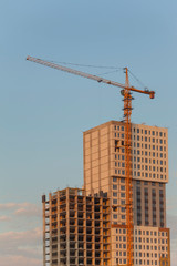 Fototapeta premium Construction site with crane against the blue sky
