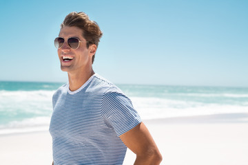 Happy man smiling at beach