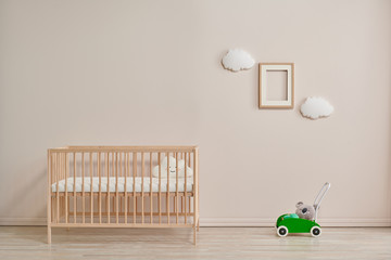 Wooden baby room furniture bed and crib, sun and cloud toys and frame style.