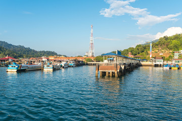 Fototapeta na wymiar Landing stage of Pulau Pangkor, what means the island of Pangkor. All ferry boats from mainland arrive in this little harbor 