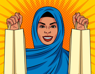 Color vector in pop art comic style girl with shopping bags. A Muslim woman in a traditional Islamic shawl on her head is shopping. Woman happy with her purchases