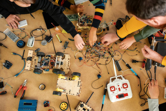 No Limits. Happy Children Working With Wires, Constructing Diy Robot In Class. Smart Kids And STEM Education.