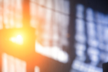 a yellow sunbeam shines through a blue rustic curtain