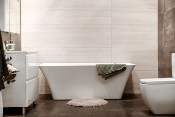Naklejka na ściany i meble Modern and cozy bathroom interior with decorative elements