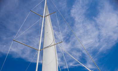 Yacht sail on blue sky