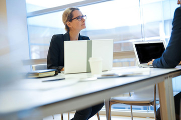 Executive people working on laptop in meeting room