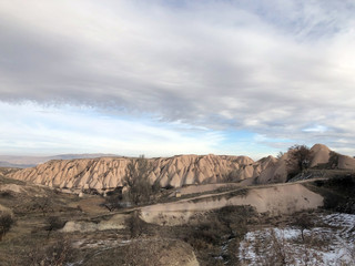 Fototapeta na wymiar View of the slope from the volcanic rock. Turkey, Cappadocia.