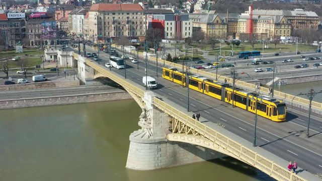 Budapest, Hungary - 4K following a yellow tram going across Margaret Bridge