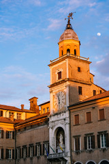 Sunset in Modena, Emilia Romagna, Italy. Communal Palace and moon